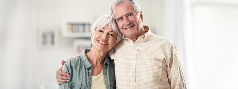 A couple smiling.