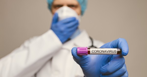 Canva - Doctor Holding the Coronavirus Blood Sample (1).jpg