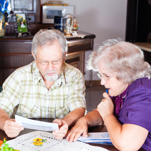 People looking at bills-small.jpg