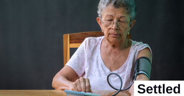 Woman taking blood pressure Woman taking blood pressure