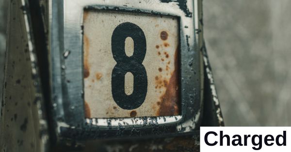 The number eight is shown inside a rusty frame.