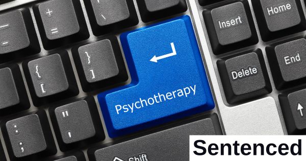 The word "psychotherapy" is on a keyboard.
