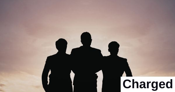 Silhouettes of three figures.