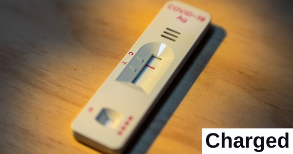 A COVID-19 test kit sits on a table.