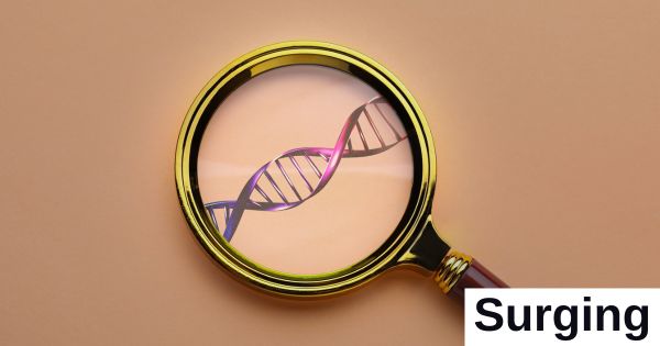A magnifying glass shows a strand of DNA.