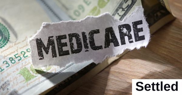 The word "Medicare" is written on a piece of paper.